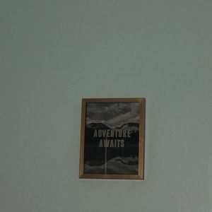 “Adventure awaits” room decor sign